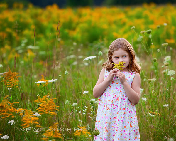 Child in field of flowers