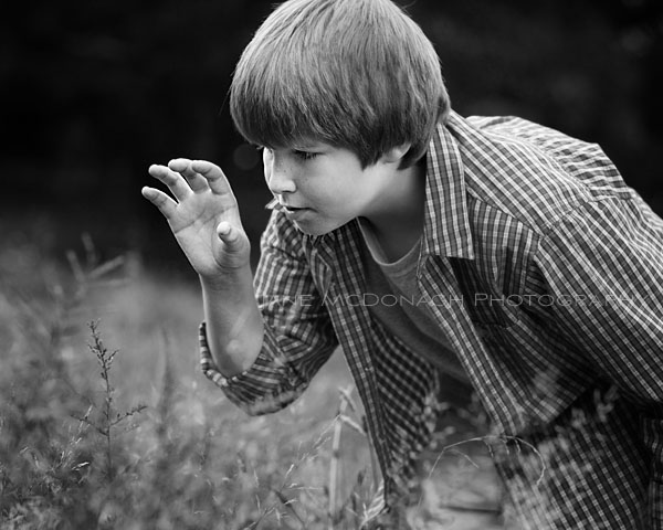 Boy catching bugs