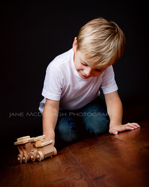 Boy playing with train
