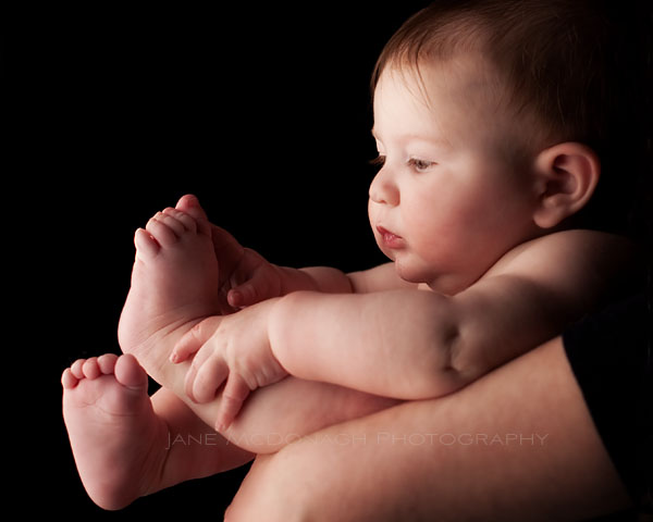 Baby playing with toes