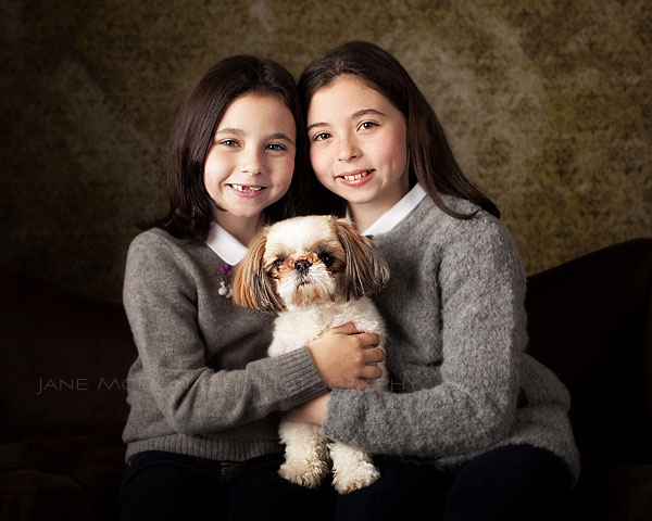 Two girls and a dog in studio